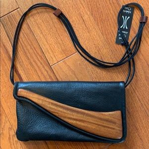 Kimberly Chalos | Hand carved mahogany handbag